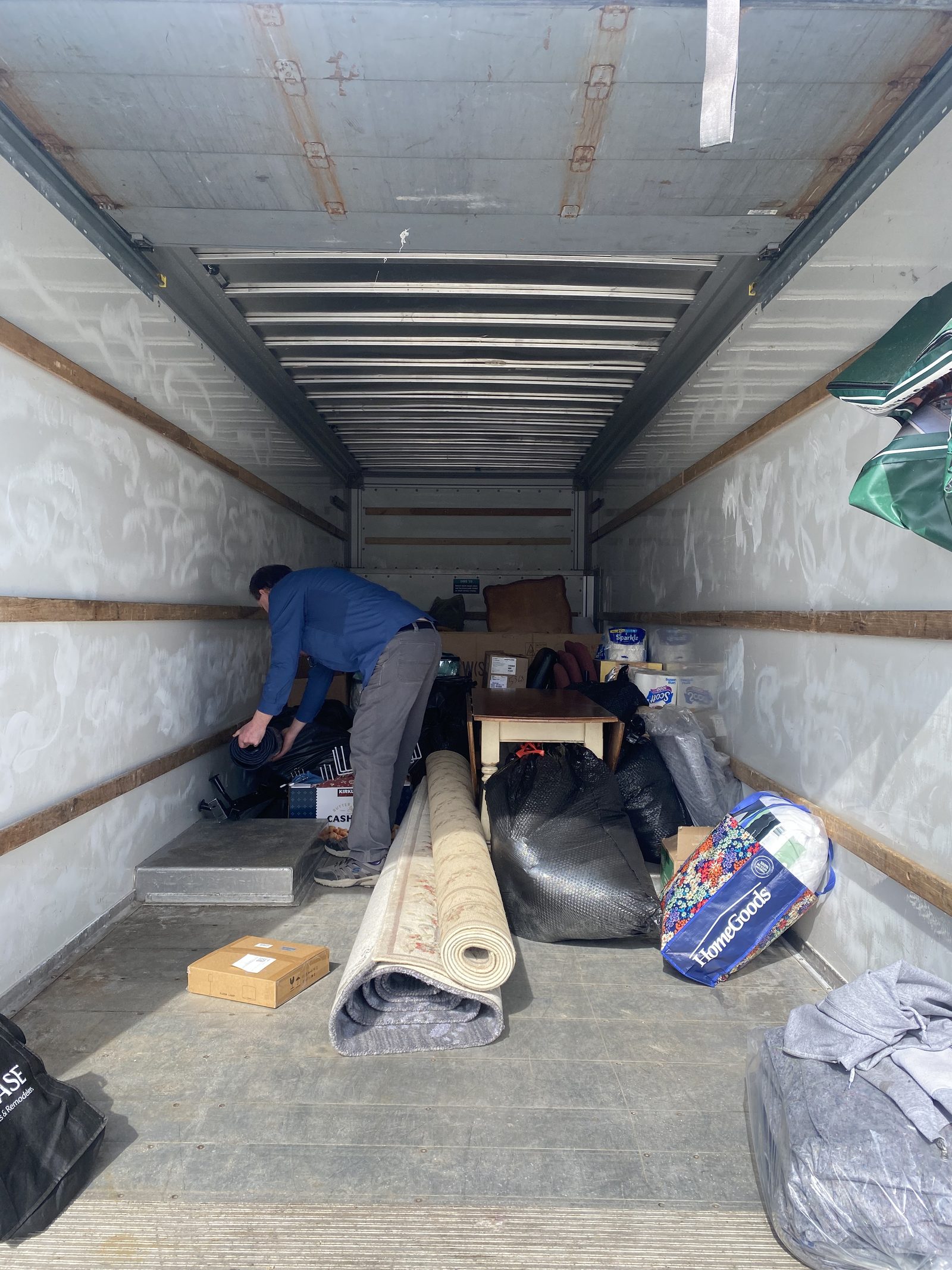 Inside a U-Haul packed with donated furniture and home goods