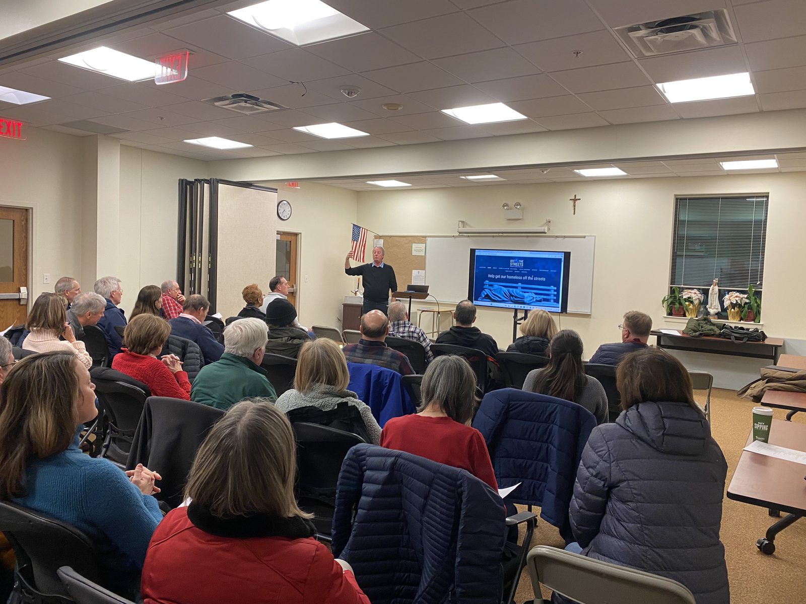 OTS Rockville volunteers seated for a meeting and presentation